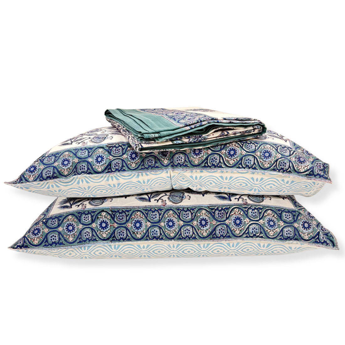 Set of blue and white patterned pillows on a white background