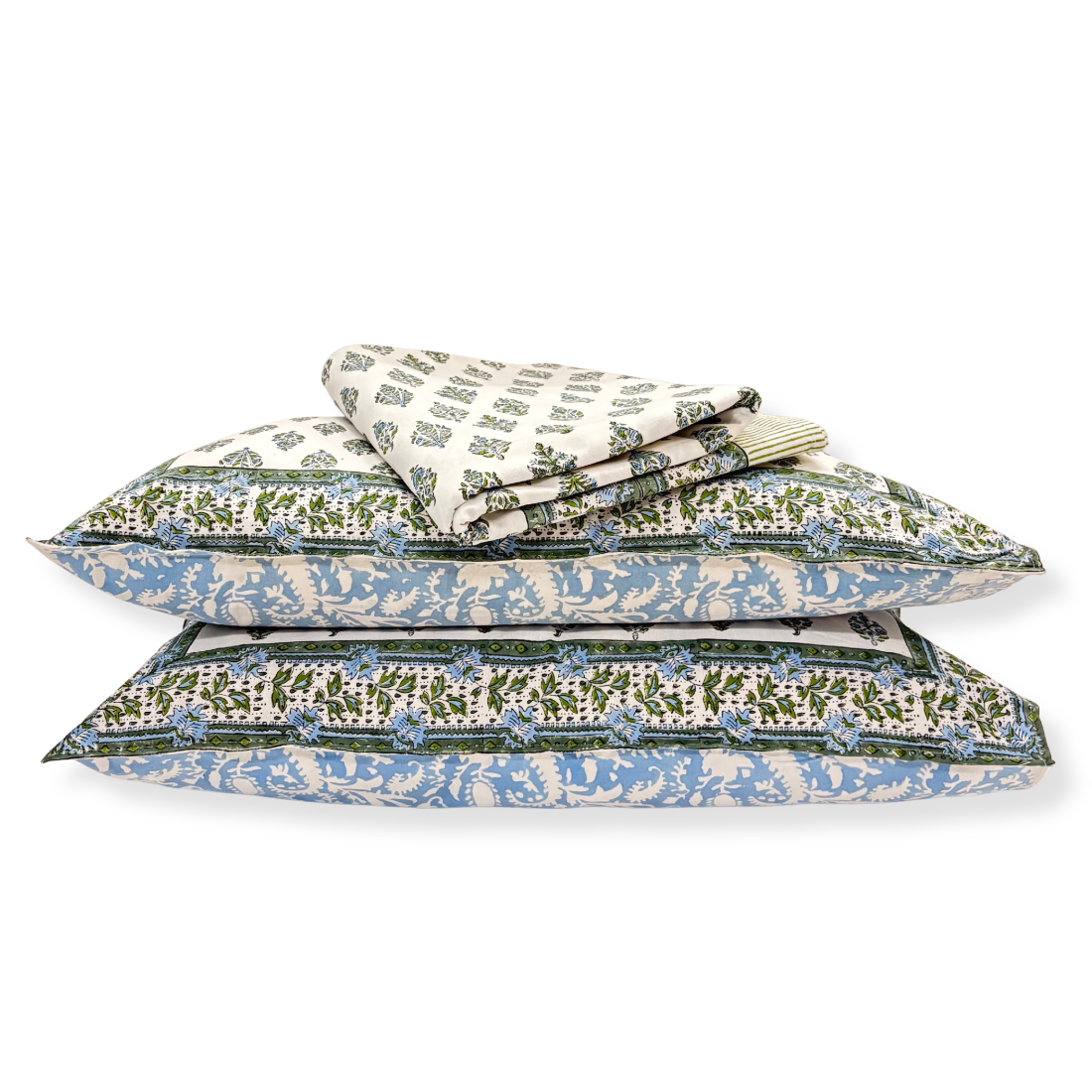 Set of folded floral-patterned pillows on a white background