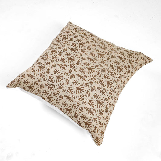 Decorative pillow with brown leaf pattern on white background