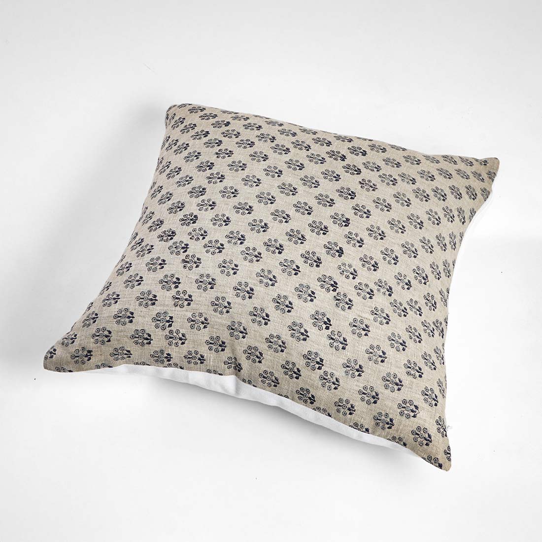 Decorative pillow with floral pattern on a white background