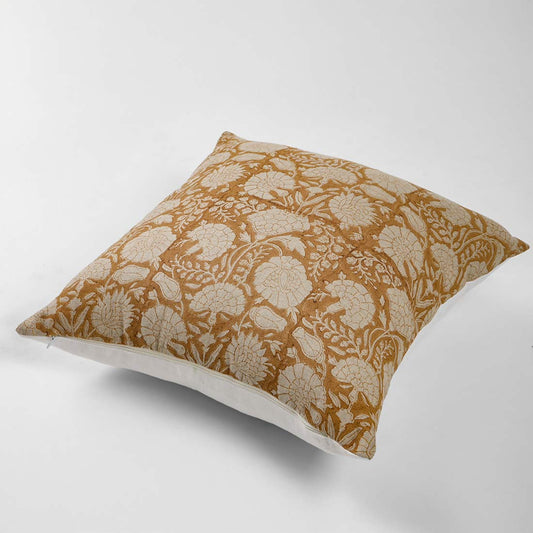 Decorative pillow with floral pattern on a yellow background