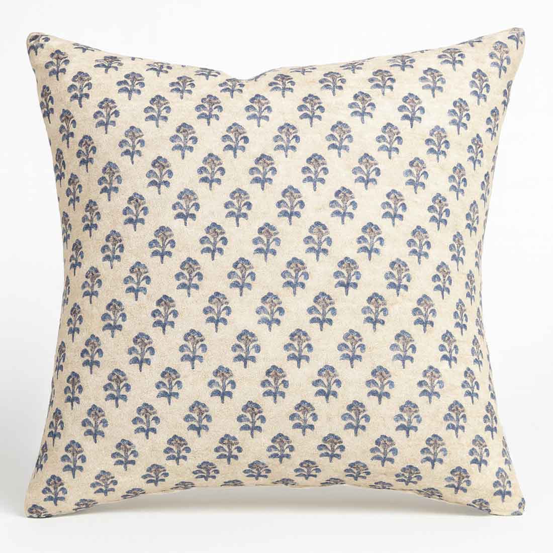 Decorative pillow with blue floral pattern on white background