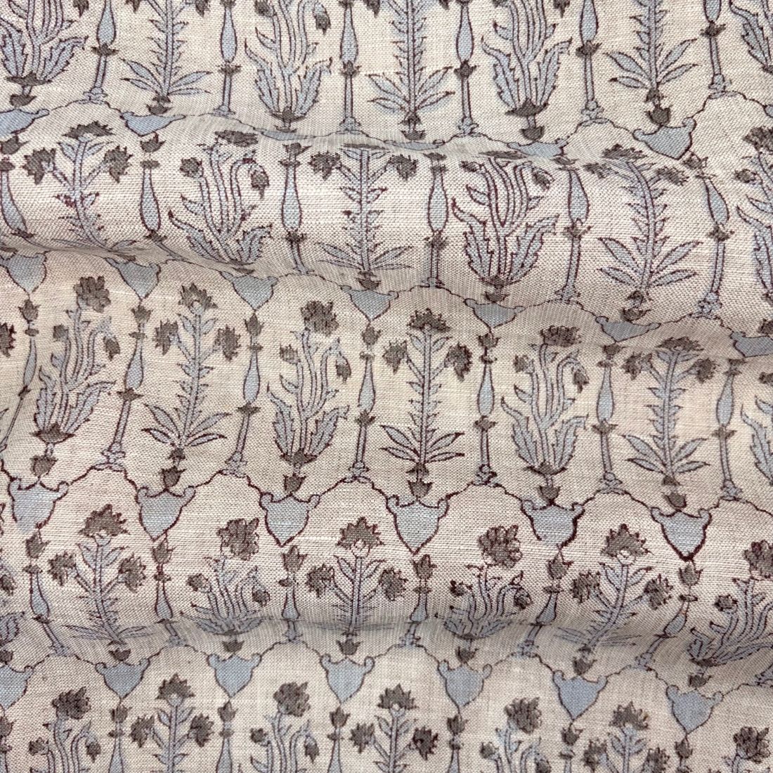 Patterned fabric with floral design on a grey background