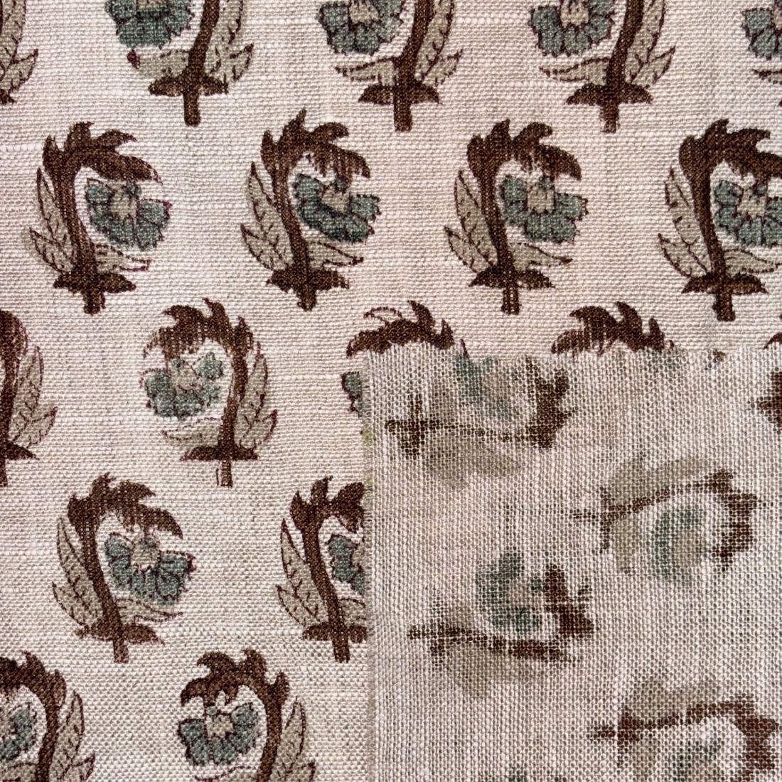 Textile pattern with brown and green leaf-like shapes on a grey background