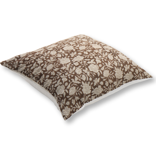 Floral-patterned pillow on a brown background