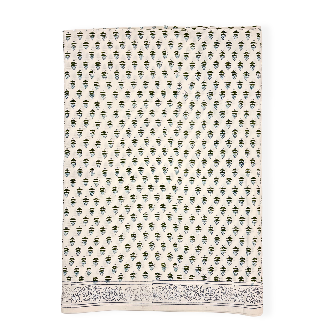 Patterned tablecloth with blue and white design on a white background