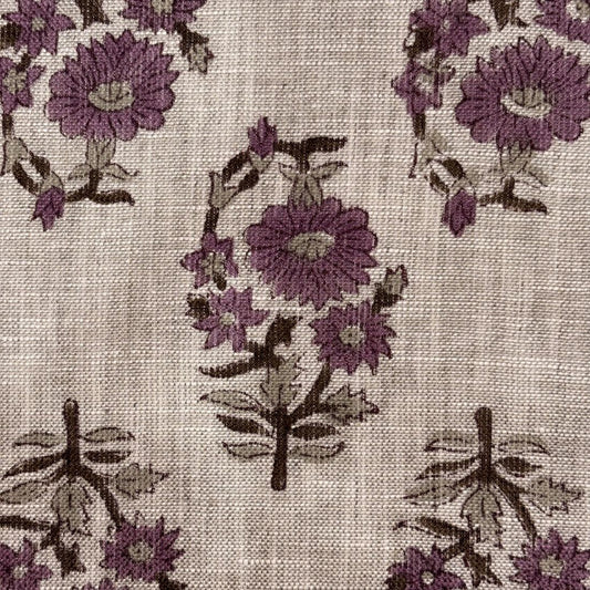 Close-up of floral pattern with purple flowers on a grey background