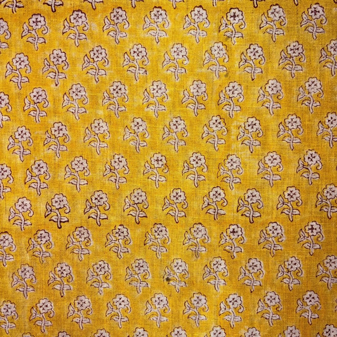 Yellow fabric with small floral pattern