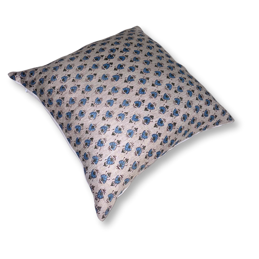 Decorative pillow with blue floral pattern on a white background