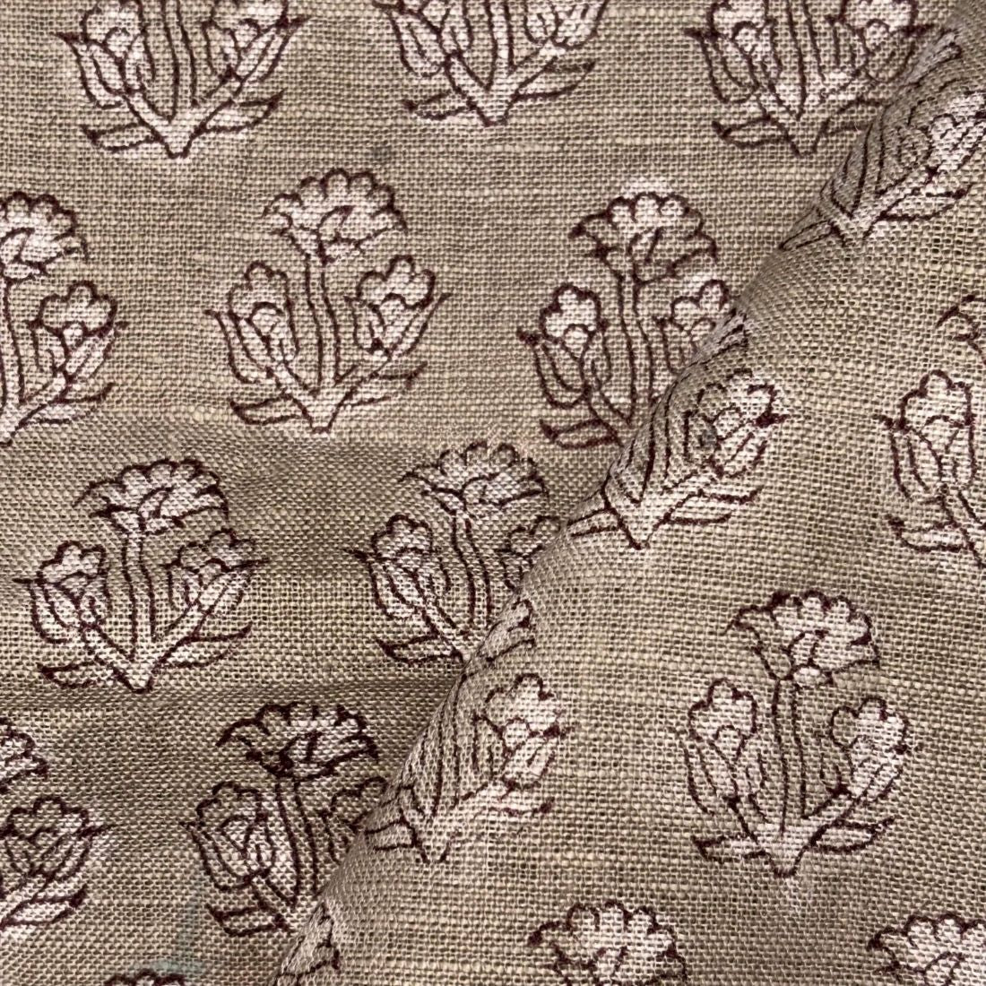 Textile fabric with floral pattern on beige background