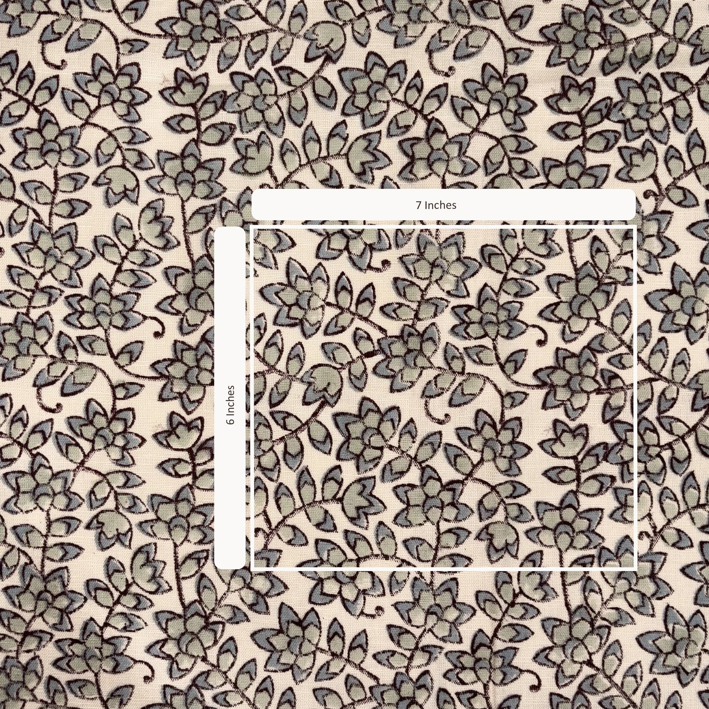 Floral patterned fabric with a ruler indicating measurements on a beige background