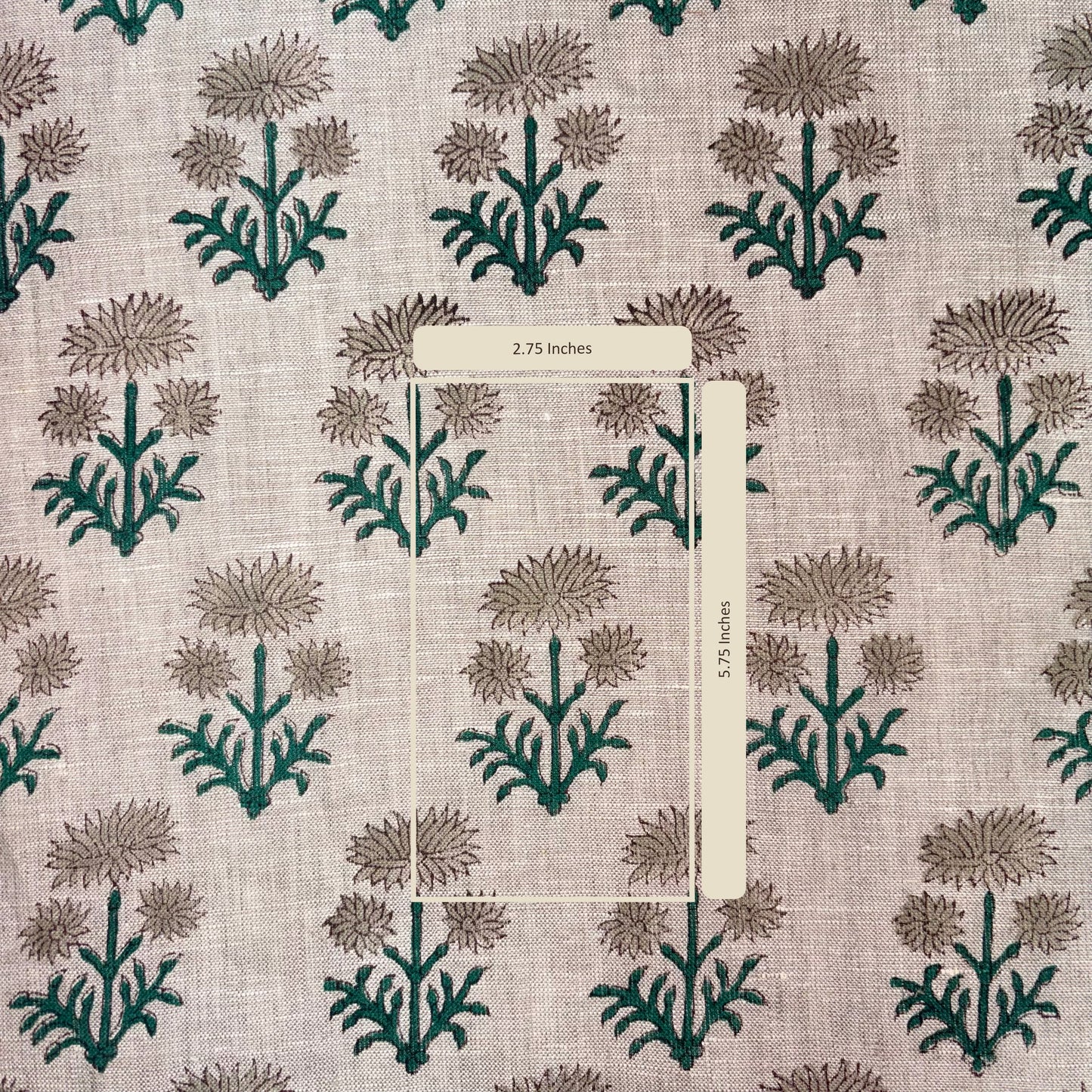 Fabric with a floral pattern and a measuring stick indicating 2.75 inches.