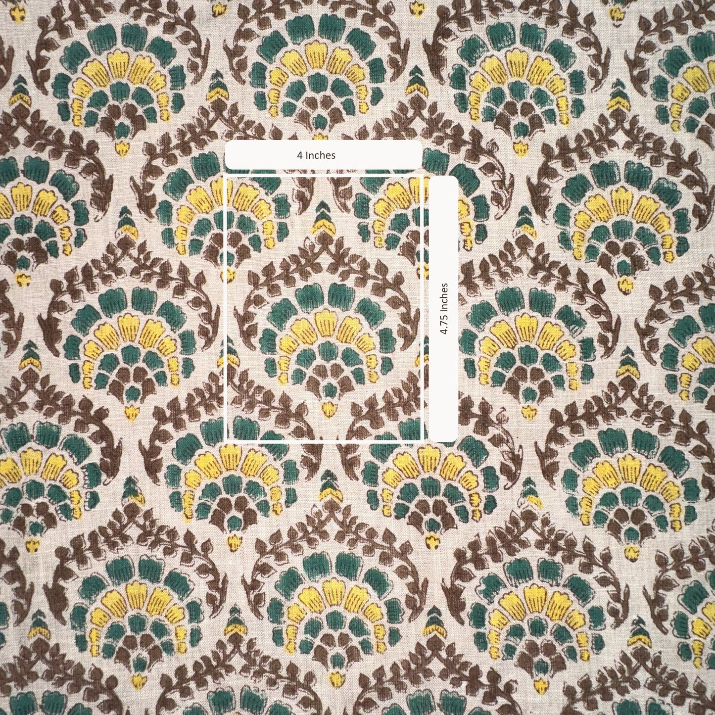 Patterned fabric with green, yellow, and brown design on a grey background