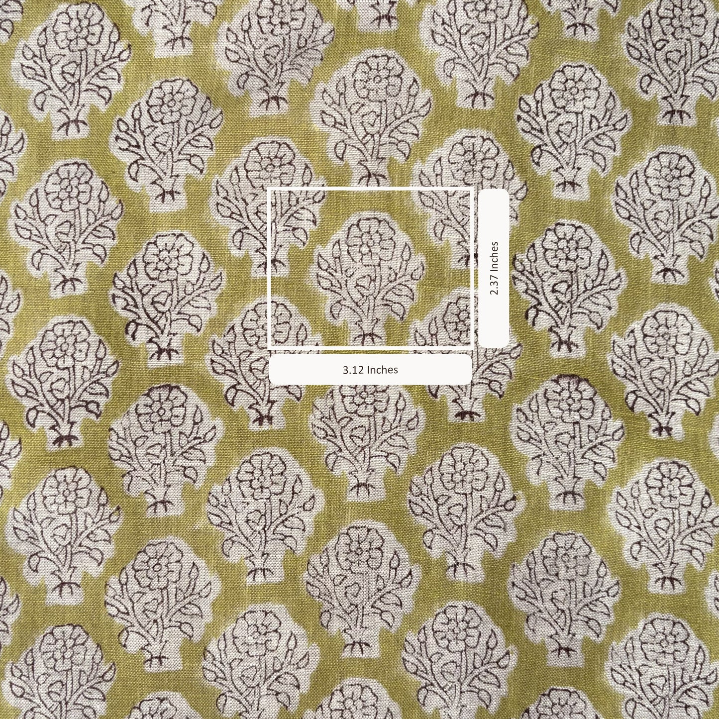 Fabric with a tree pattern and measurement label on a green background