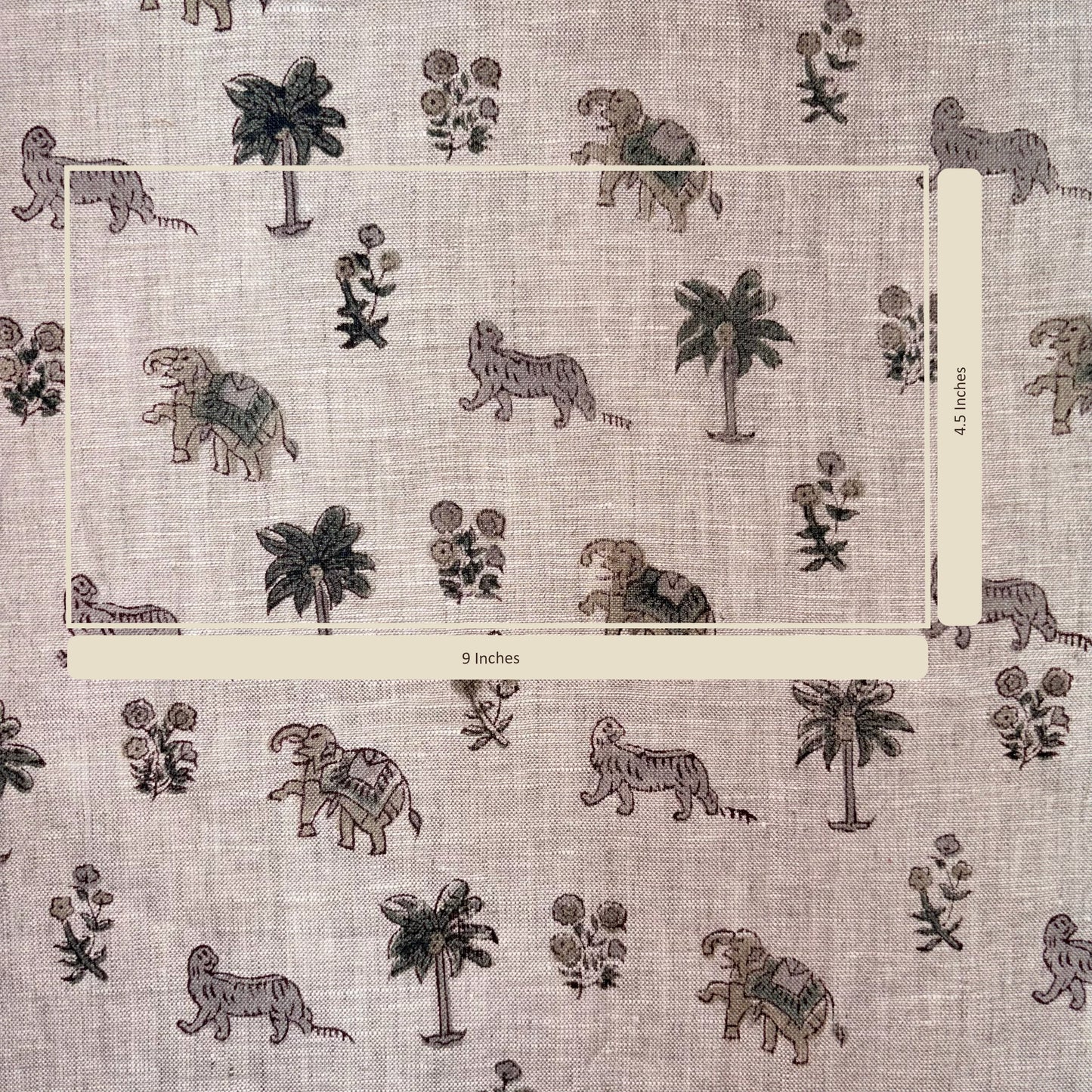 Patterned fabric with elephants, tigers, and palm trees on a grey background