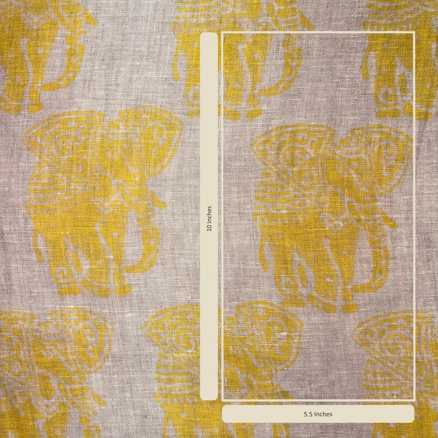 Fabric with yellow elephant pattern and a ruler for scale on a gray background