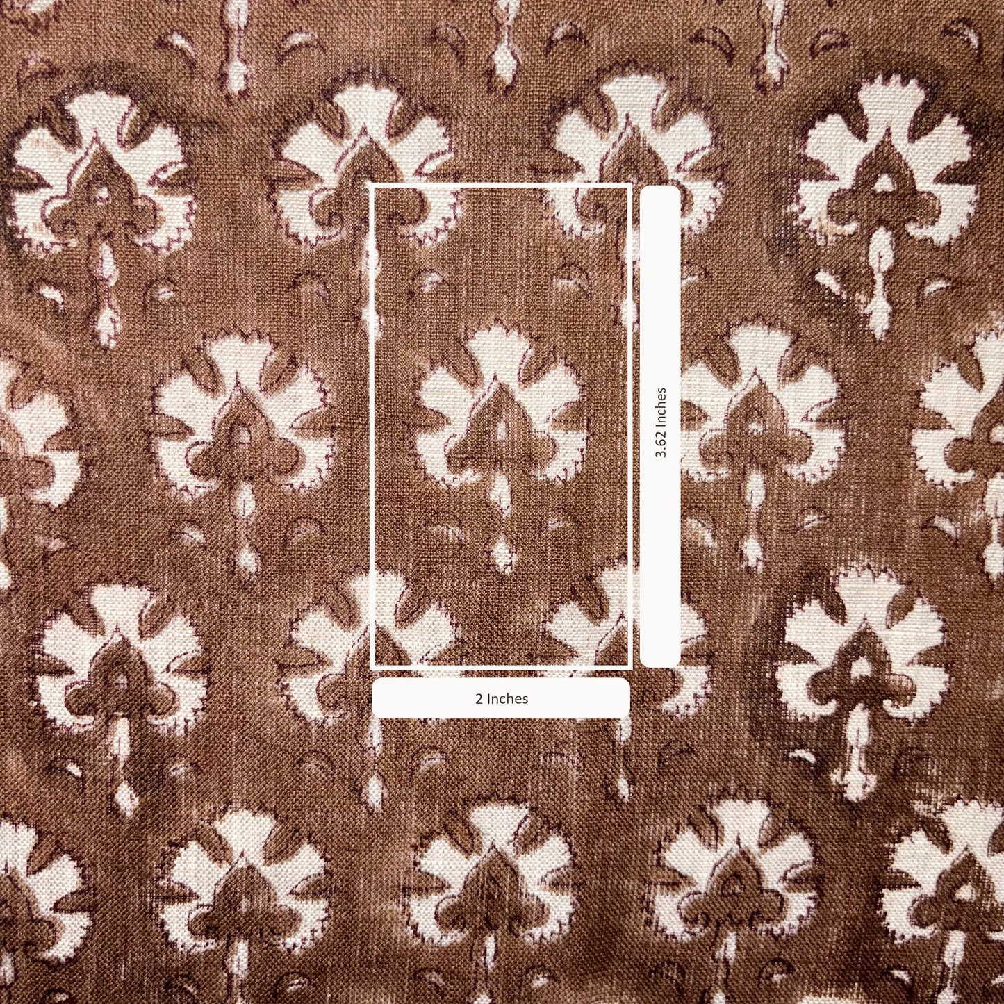 Brown fabric with white floral pattern and measurement scale