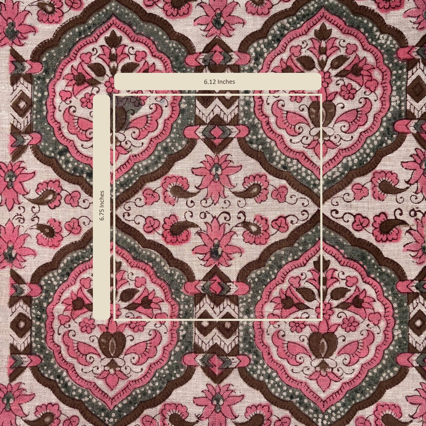 Patterned fabric with pink and brown design on a white background
