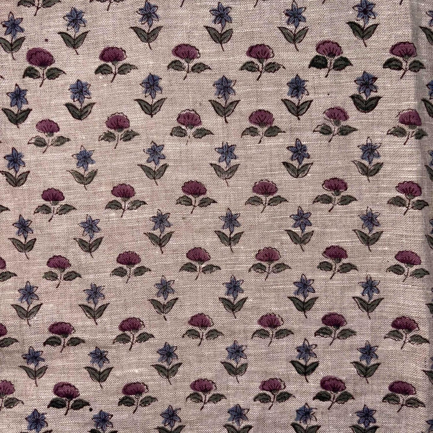 Fabric with small floral pattern on a grey background