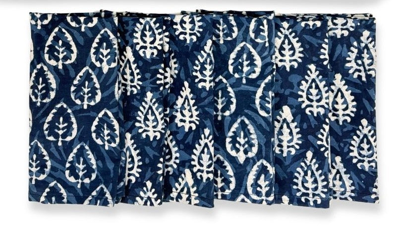 Set of blue and white patterned curtains with a leaf design.