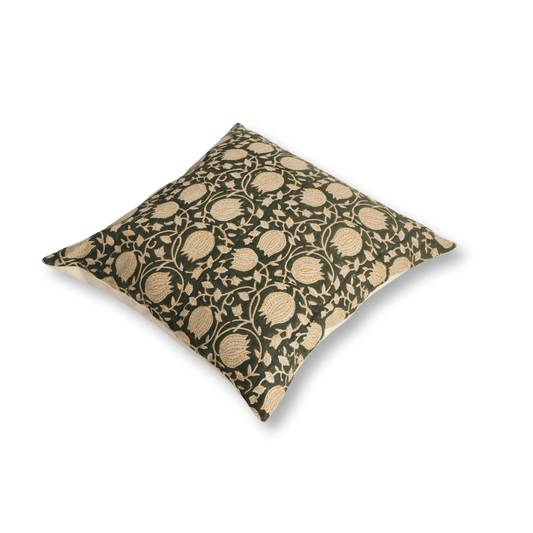 Decorative pillow with floral pattern on a green background
