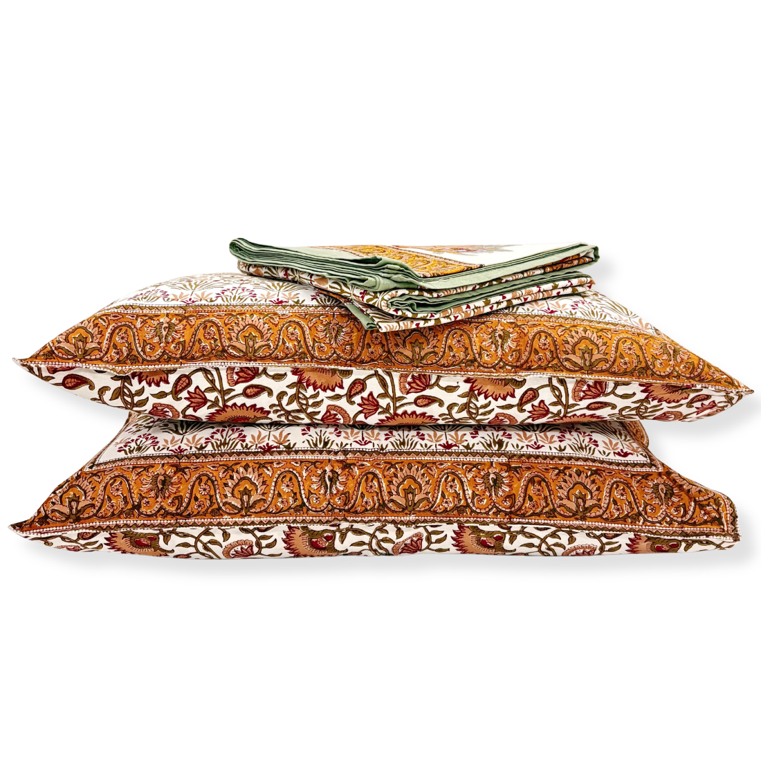 Stack of patterned pillows on a white background