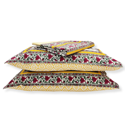 Stack of patterned pillows on a white background