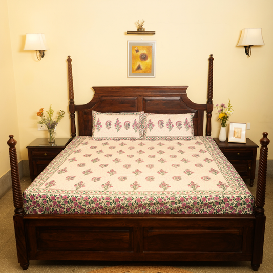 Wooden bed with floral bedding in a bedroom setting