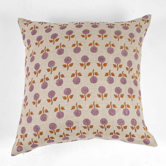 Decorative pillow with purple floral pattern on pink background