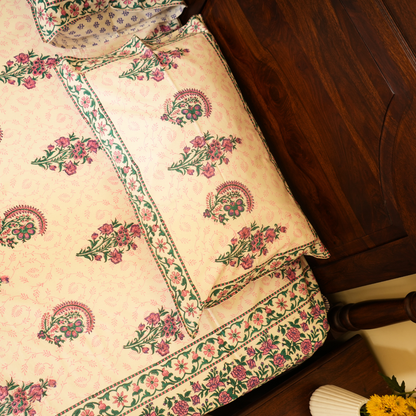 Decorative pillow with floral patterns on a wooden surface