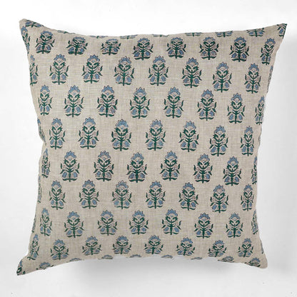 Decorative pillow with a green and blue floral pattern on a white background