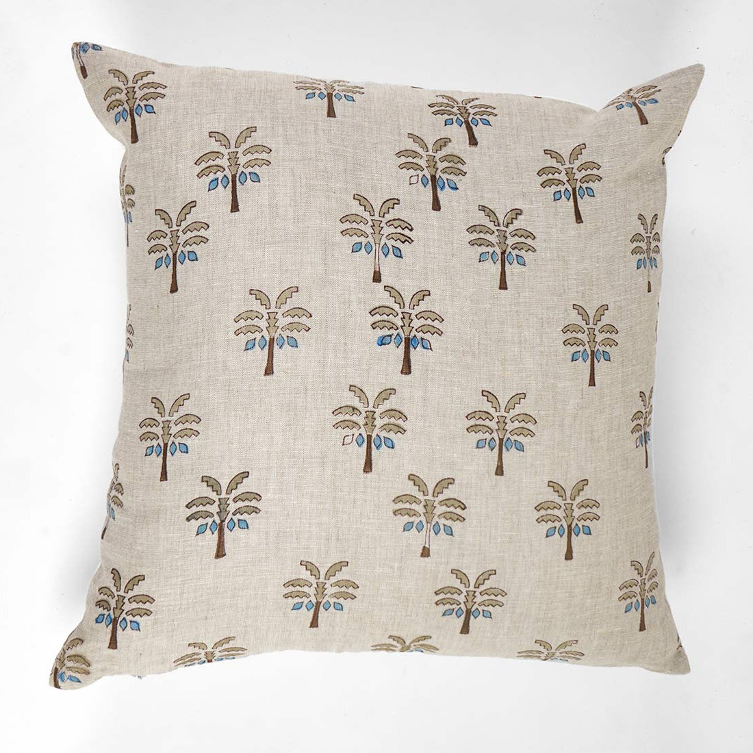 Decorative pillow with palm tree pattern on a white background