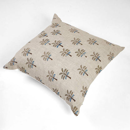 Decorative pillow with palm tree pattern on a white background