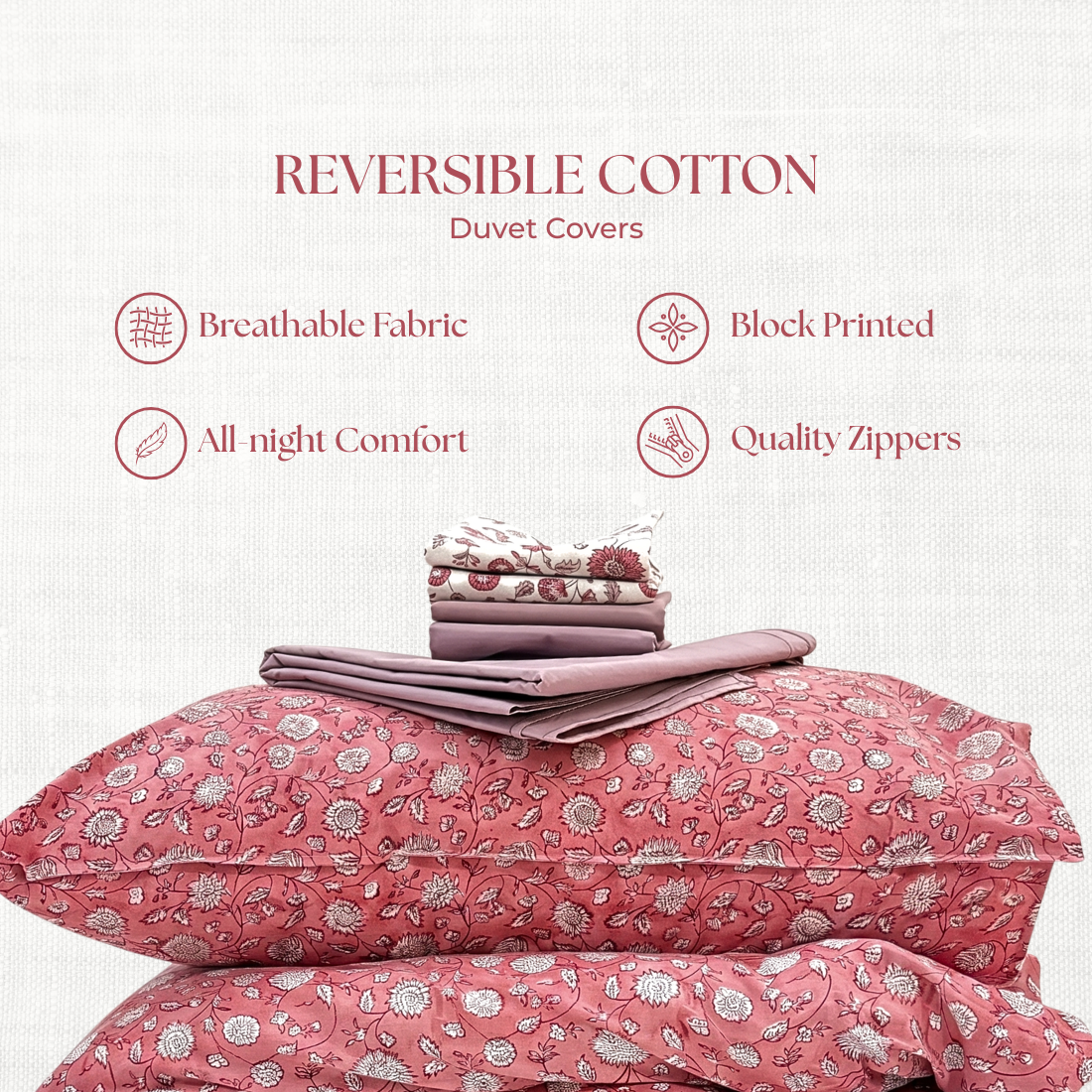 Pink floral duvet set with reversible cotton features on a white background