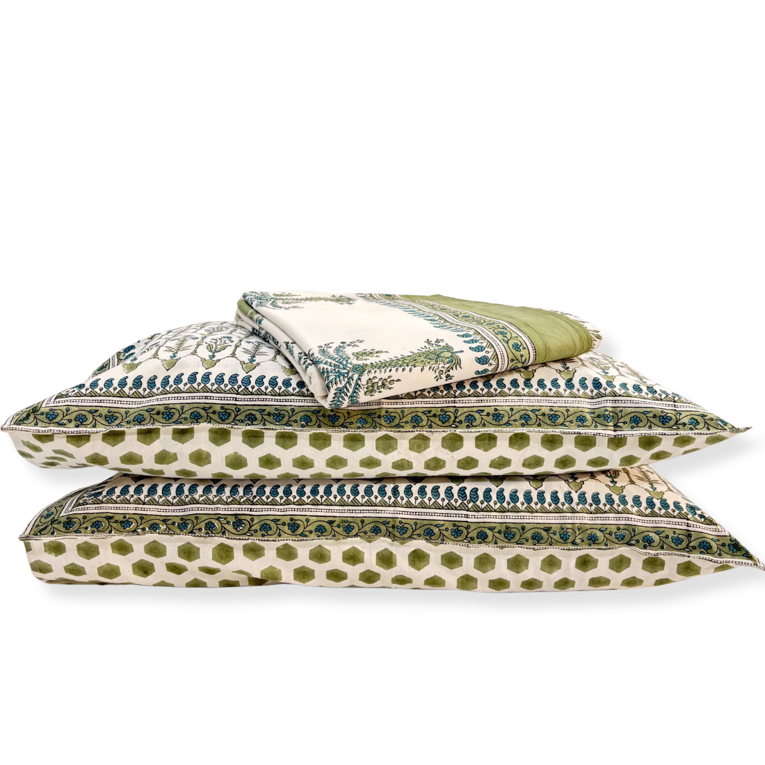 Set of green and white patterned pillows on a white background