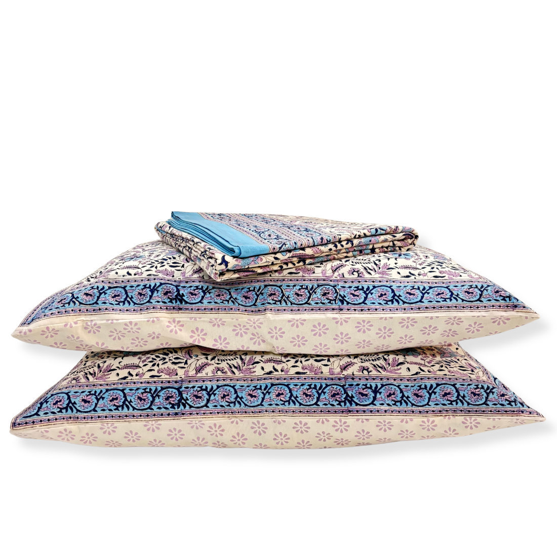 Stack of patterned pillows on a white background
