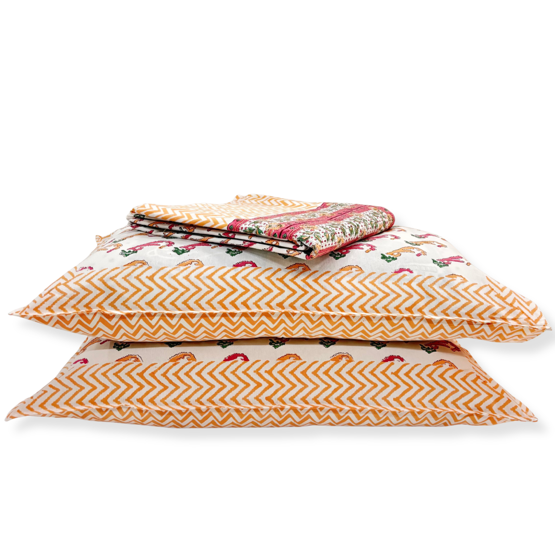 Stack of patterned pillows on a white background