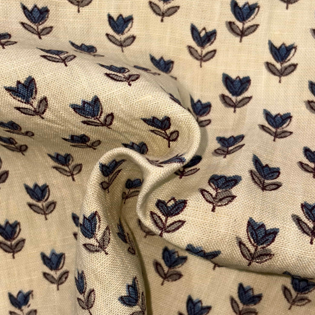 Fabric with blue floral pattern on beige background