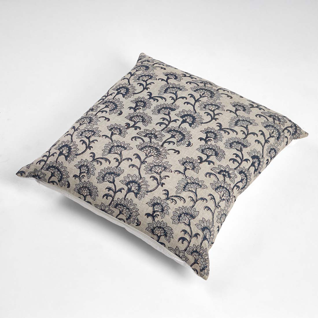Decorative pillow with floral pattern on a white background