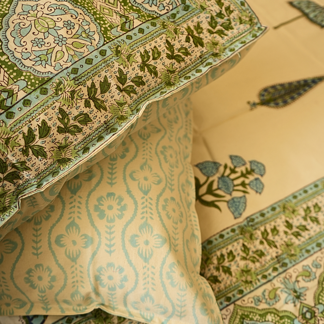 Close-up of patterned fabric with green and beige colors