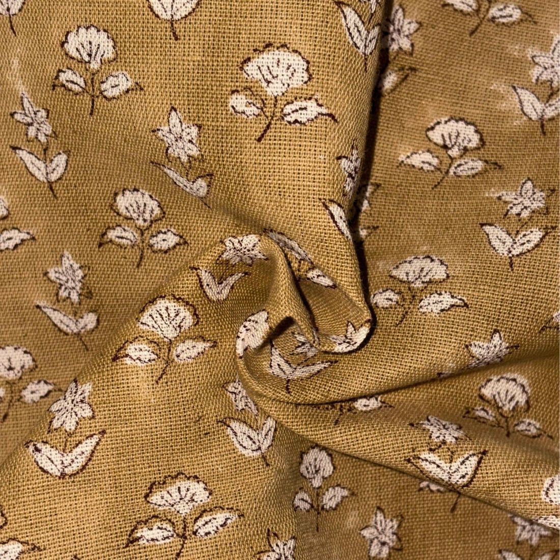 Brown fabric with white floral pattern