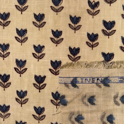 Beige fabric with blue floral pattern and 'LINEN' label