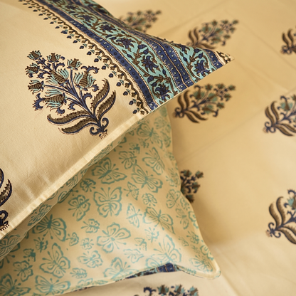 Decorative pillows with intricate patterns on a beige background