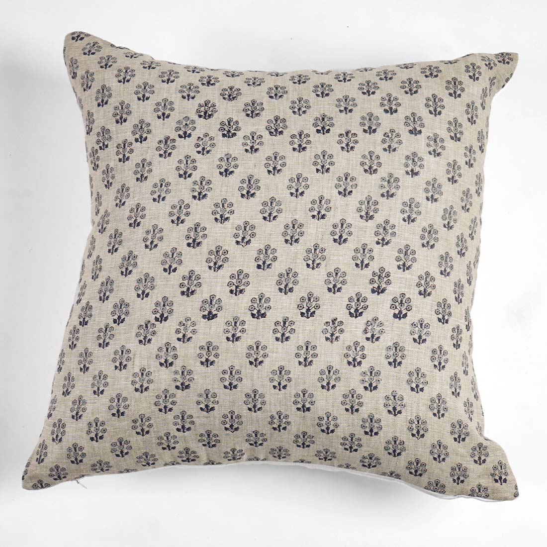 Decorative pillow with floral pattern on a white background
