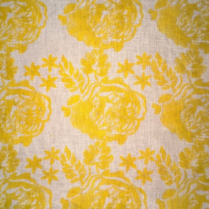 Yellow floral pattern on a beige fabric background