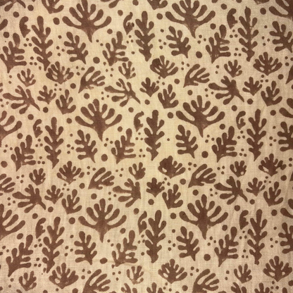 Brown leaf pattern on beige fabric