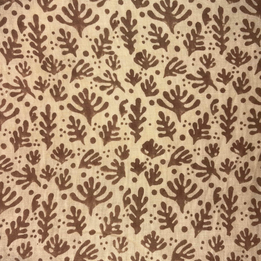 Brown leaf pattern on beige fabric