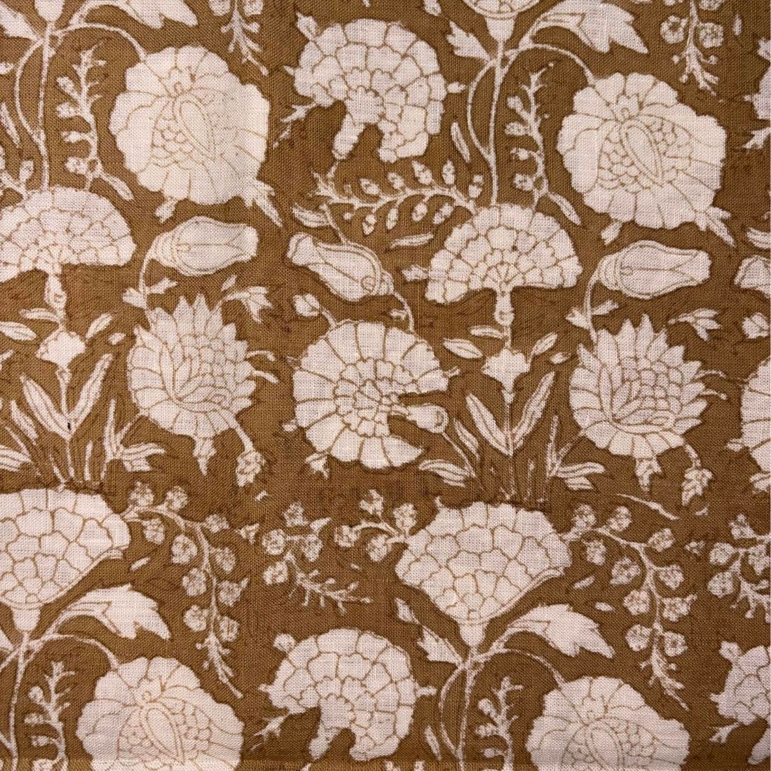 Floral pattern on fabric with beige flowers on a beige background
