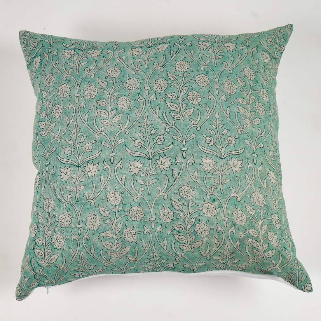 Decorative pillow with floral pattern on a white background