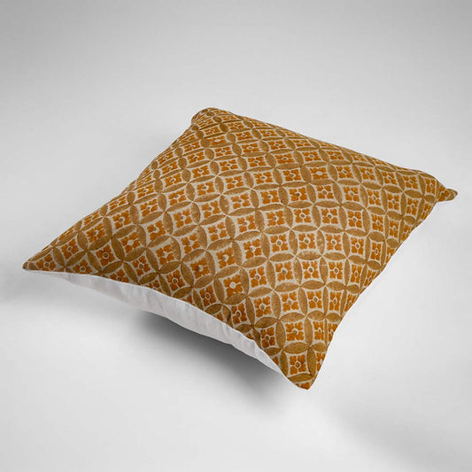 Patterned pillow on a yellow background